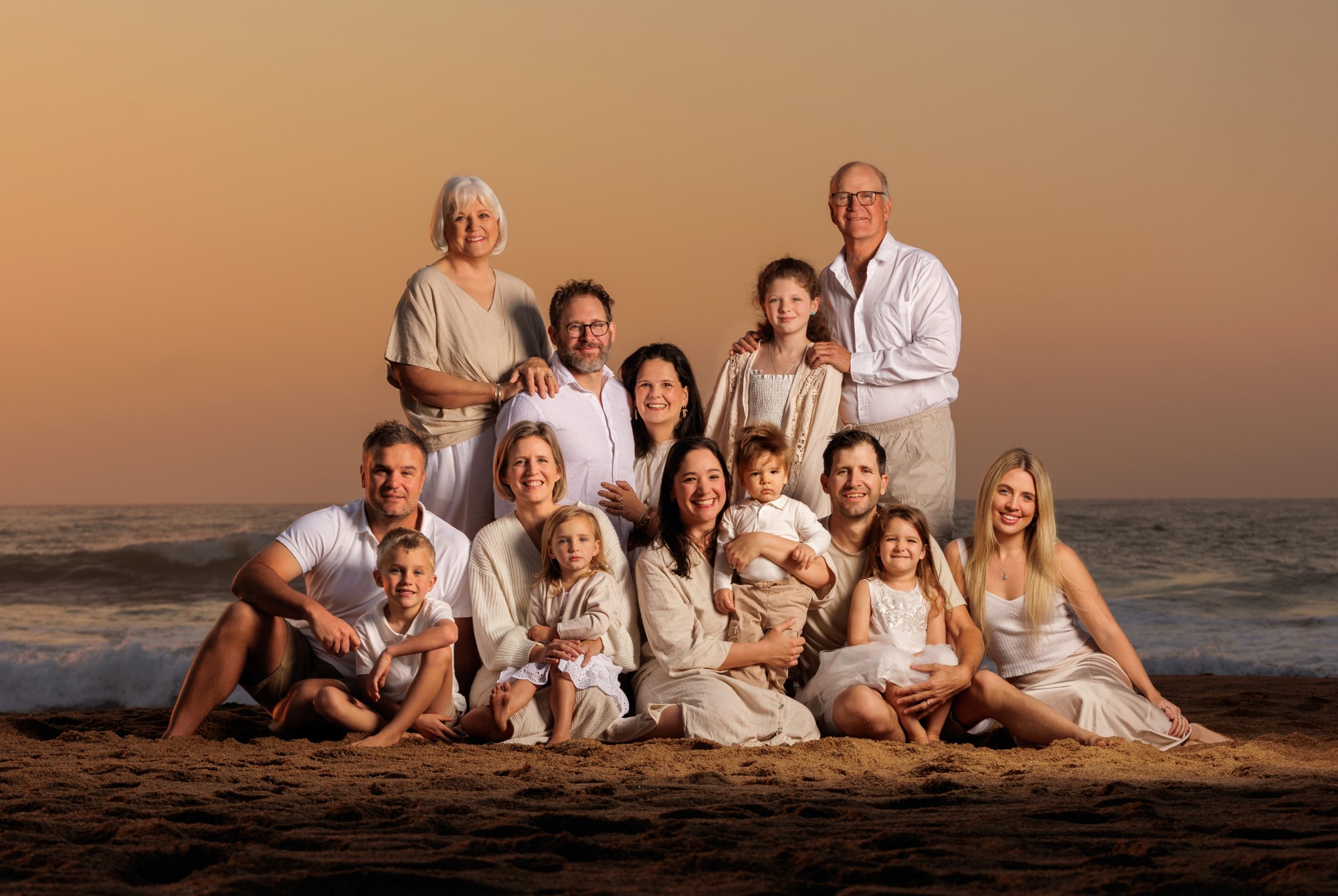 Family portrait on the beach at sunset